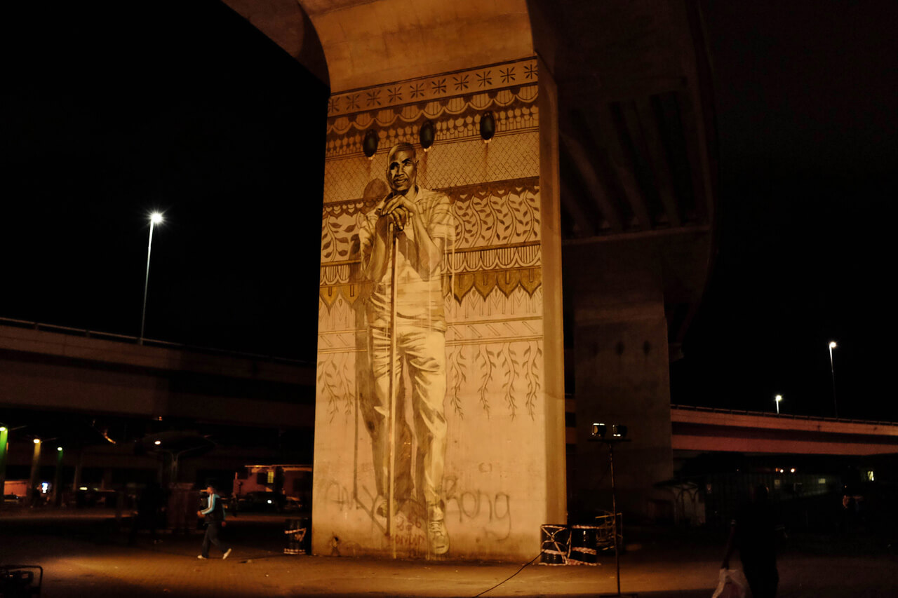 View of a single portrait mural during the night