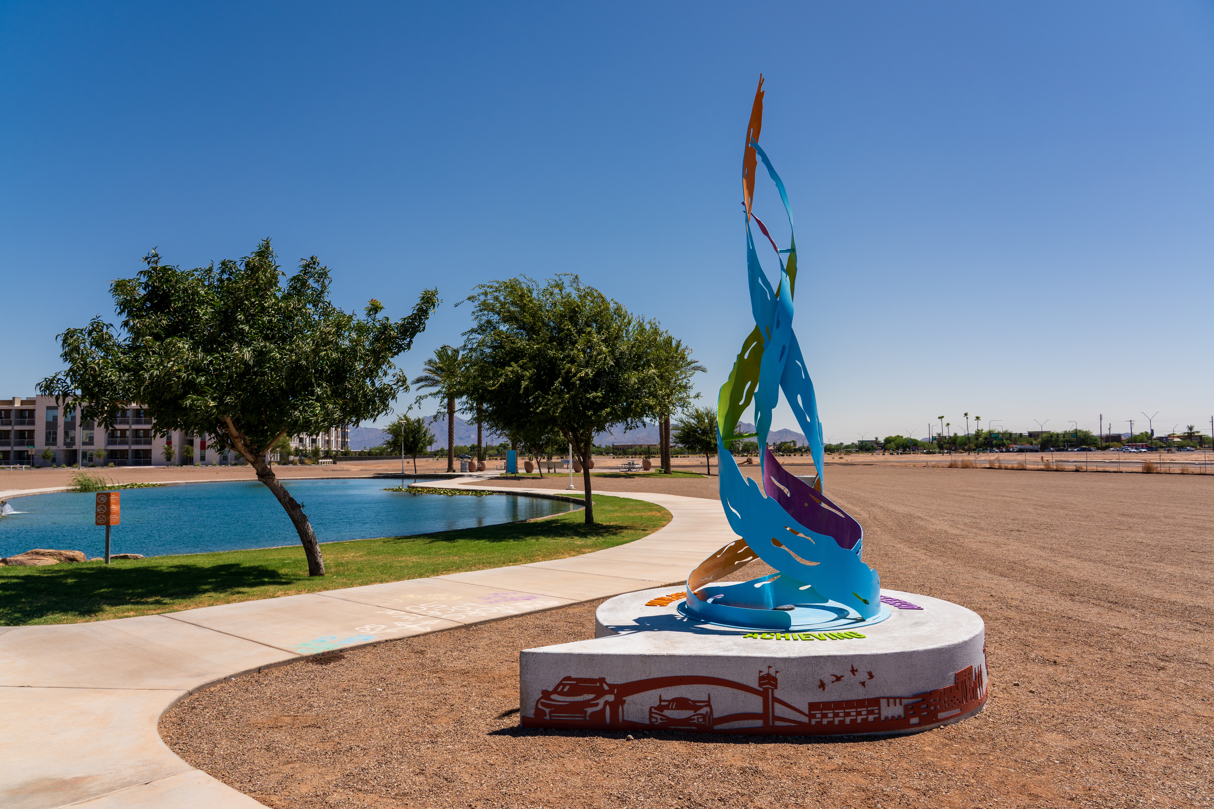 The vibrant colors finish of the sculpture stands in striking contrast against the Arizona sky, highlighting the sculpture's role as a beacon of unity at The BLVD.