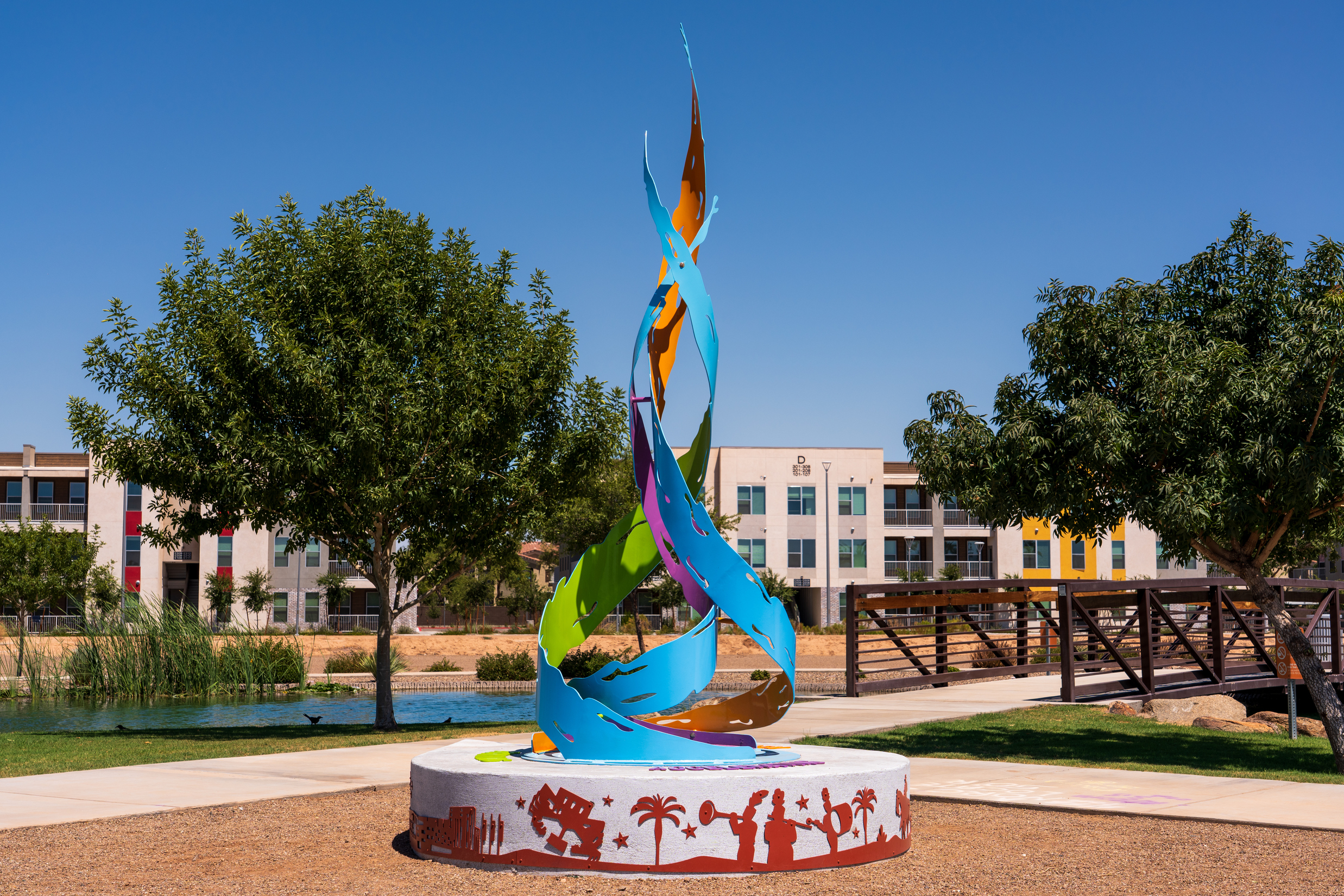A detailed view of the three twisting spires of "Confluence," showcasing how the interlaced steel forms represent the meeting of the Agua Fria, Salt, and Gila rivers.